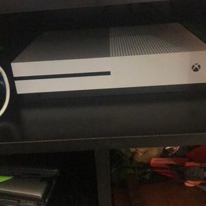 XBOX with 2 controllers. 1 wired 1 wireless.